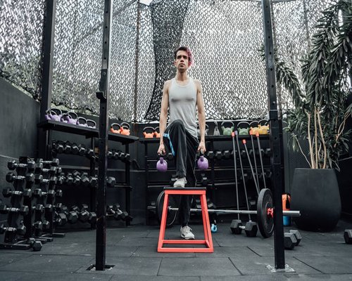 Active functional training class with kettlebells and box jumps